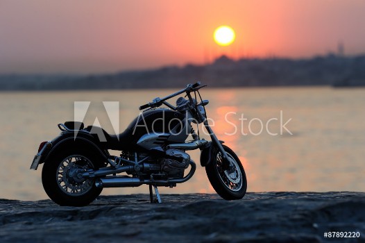 Picture of Motorcycle on the rocks in sunset and golden hours